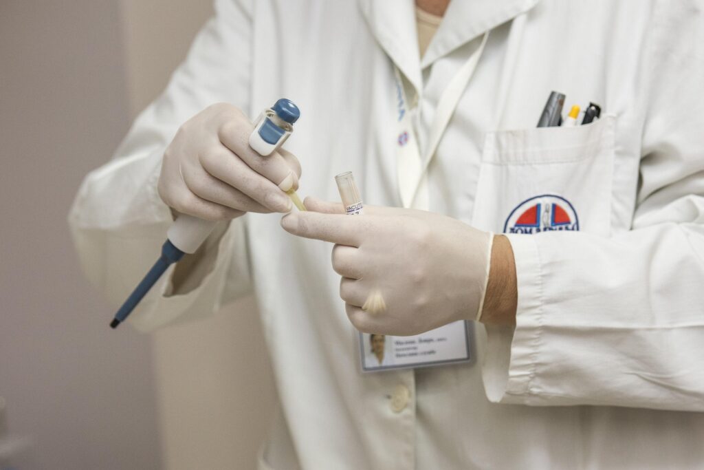 Healthcare professional preparing a blood sample for A1C diabetes testing